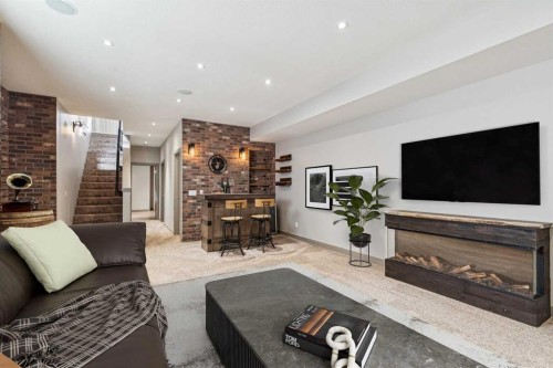 2011 48 Avenue Sw, Calgary, AB - Indoor Photo Showing Living Room With Fireplace