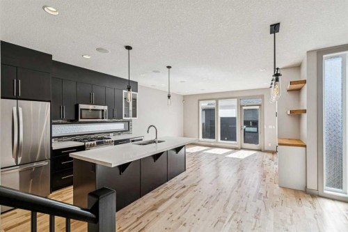 2011 48 Avenue Sw, Calgary, AB - Indoor Photo Showing Kitchen With Double Sink With Upgraded Kitchen
