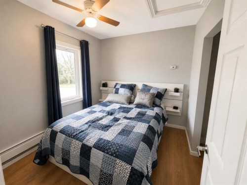 132 8 Avenue, Gleichen, AB - Indoor Photo Showing Bedroom