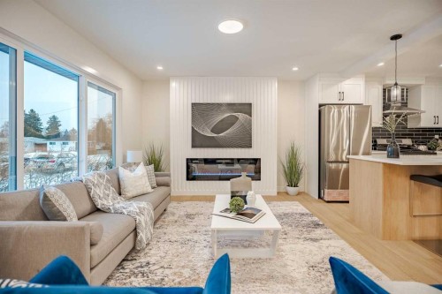 451 Arlington Drive Se, Calgary, AB - Indoor Photo Showing Living Room With Fireplace