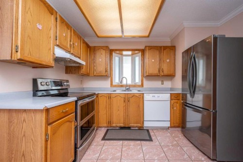 136 Hunterhorn Drive Ne, Calgary, AB - Indoor Photo Showing Kitchen With Double Sink
