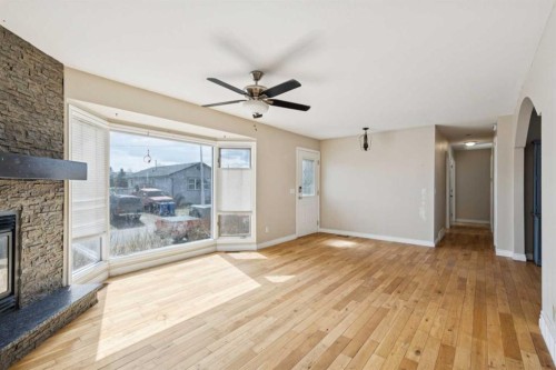 201 Southridge Place, Didsbury, AB - Indoor With Fireplace