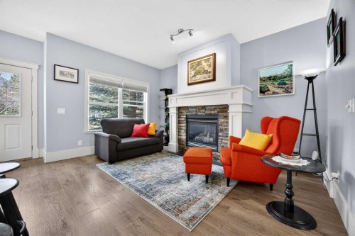 83 Wentworth Common Sw, Calgary, AB - Indoor Photo Showing Living Room With Fireplace