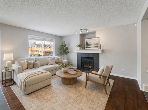 72 Pantego Close Nw, Calgary, AB - Indoor Photo Showing Living Room With Fireplace
