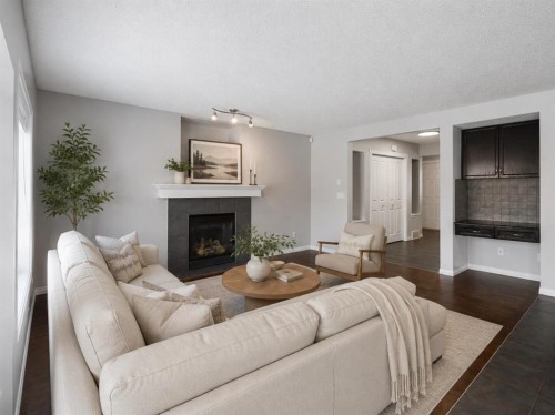 72 Pantego Close Nw, Calgary, AB - Indoor Photo Showing Living Room With Fireplace