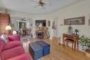 2318 Bowness Road Nw, Calgary, AB  - Indoor Photo Showing Living Room With Fireplace 