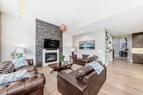 193 Kinniburgh Circle, Chestermere, AB - Indoor Photo Showing Living Room With Fireplace