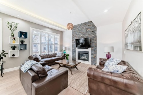 193 Kinniburgh Circle, Chestermere, AB - Indoor Photo Showing Living Room With Fireplace