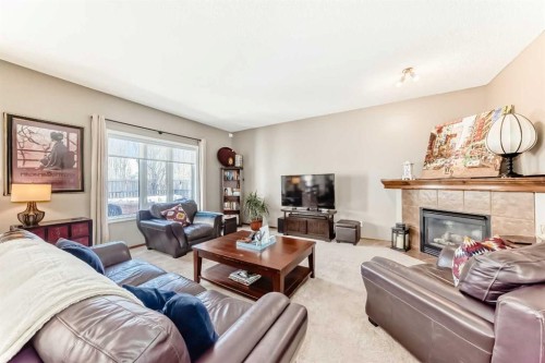 182 Chapalina Close Se, Calgary, AB - Indoor Photo Showing Living Room With Fireplace