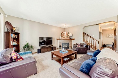 182 Chapalina Close Se, Calgary, AB - Indoor Photo Showing Living Room With Fireplace