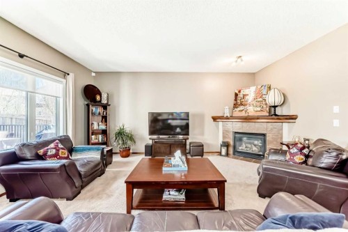 182 Chapalina Close Se, Calgary, AB - Indoor Photo Showing Living Room With Fireplace