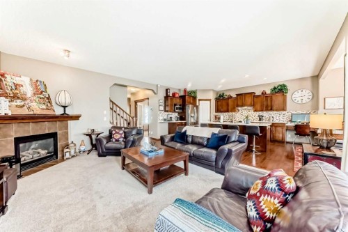 182 Chapalina Close Se, Calgary, AB - Indoor Photo Showing Living Room With Fireplace
