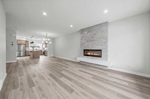 46 Versant View Sw, Calgary, AB - Indoor Photo Showing Living Room With Fireplace