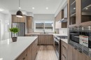 46 Versant View Sw, Calgary, AB  - Indoor Photo Showing Kitchen With Stainless Steel Kitchen With Upgraded Kitchen 