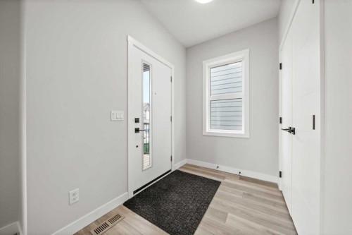 46 Versant View Sw, Calgary, AB - Indoor Photo Showing Other Room