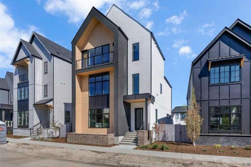 336 Normandy Drive Sw, Calgary, AB - Outdoor With Facade