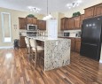 7-43 Westlake Circle, Strathmore, AB  - Indoor Photo Showing Kitchen With Upgraded Kitchen 