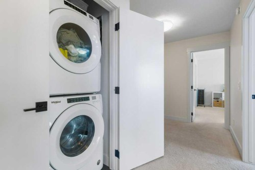 222 Seton Passage Se, Calgary, AB - Indoor Photo Showing Laundry Room