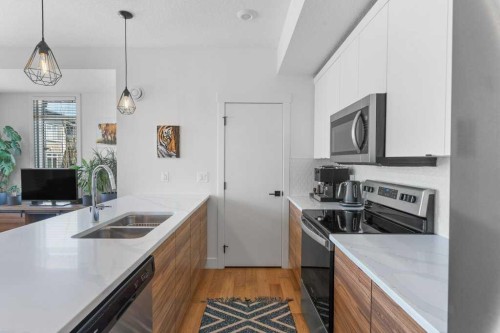 222 Seton Passage Se, Calgary, AB - Indoor Photo Showing Kitchen With Double Sink