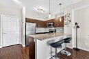 211-200 Cranfield Common Se, Calgary, AB  - Indoor Photo Showing Kitchen With Stainless Steel Kitchen With Upgraded Kitchen 