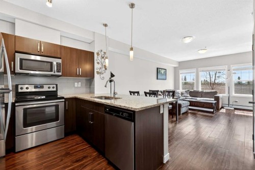 211-200 Cranfield Common Se, Calgary, AB - Indoor Photo Showing Kitchen With Stainless Steel Kitchen With Upgraded Kitchen