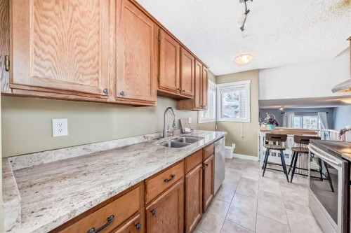 216 Hawkwood Boulevard Nw, Calgary, AB - Indoor Photo Showing Kitchen With Double Sink