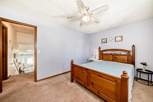 216 Hawkwood Boulevard Nw, Calgary, AB - Indoor Photo Showing Bedroom