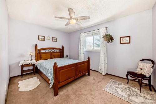 216 Hawkwood Boulevard Nw, Calgary, AB - Indoor Photo Showing Bedroom