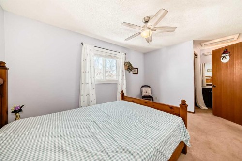 216 Hawkwood Boulevard Nw, Calgary, AB - Indoor Photo Showing Bedroom