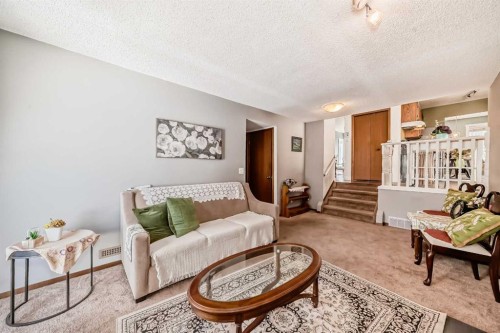 216 Hawkwood Boulevard Nw, Calgary, AB - Indoor Photo Showing Living Room