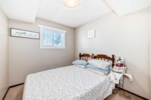 216 Hawkwood Boulevard Nw, Calgary, AB - Indoor Photo Showing Bedroom