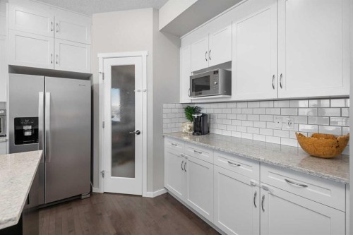 49 Tuscany Ridge Circle Nw, Calgary, AB - Indoor Photo Showing Kitchen With Stainless Steel Kitchen With Upgraded Kitchen