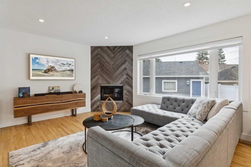 4412 Amiens Road Sw, Calgary, AB - Indoor Photo Showing Living Room With Fireplace