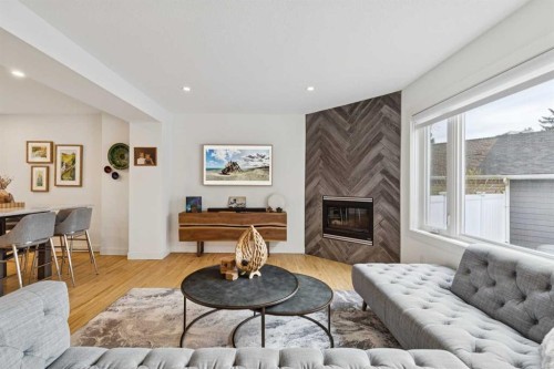 4412 Amiens Road Sw, Calgary, AB - Indoor Photo Showing Living Room With Fireplace