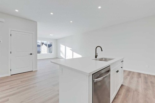 117 5 Avenue Se, High River, AB - Indoor Photo Showing Kitchen With Double Sink