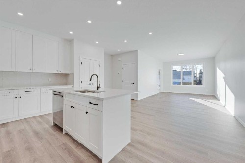 117 5 Avenue Se, High River, AB - Indoor Photo Showing Kitchen With Double Sink