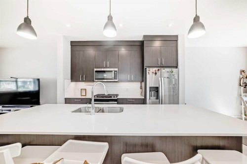 120 Chelsea Drive, Chestermere, AB - Indoor Photo Showing Kitchen With Double Sink With Upgraded Kitchen