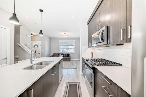 120 Chelsea Drive, Chestermere, AB - Indoor Photo Showing Kitchen With Double Sink With Upgraded Kitchen