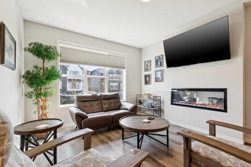 93 Wolf Gate, Okotoks, AB - Indoor Photo Showing Living Room With Fireplace