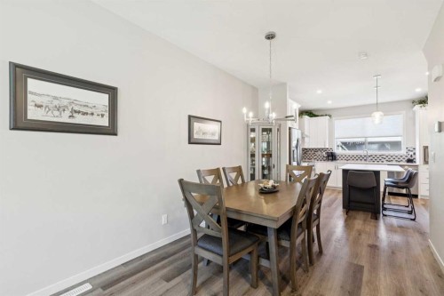 93 Wolf Gate, Okotoks, AB - Indoor Photo Showing Dining Room