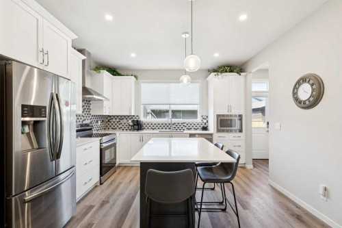 93 Wolf Gate, Okotoks, AB - Indoor Photo Showing Kitchen With Upgraded Kitchen