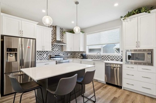 93 Wolf Gate, Okotoks, AB - Indoor Photo Showing Kitchen With Upgraded Kitchen
