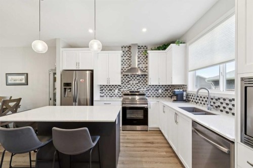 93 Wolf Gate, Okotoks, AB - Indoor Photo Showing Kitchen With Double Sink With Upgraded Kitchen