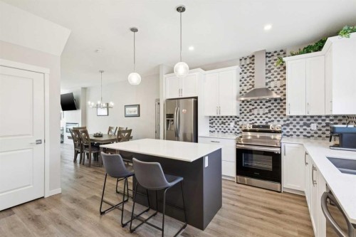 93 Wolf Gate, Okotoks, AB - Indoor Photo Showing Kitchen With Upgraded Kitchen