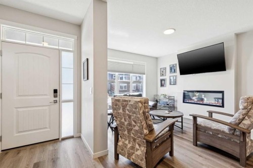 93 Wolf Gate, Okotoks, AB - Indoor With Fireplace
