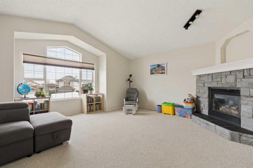 68 Cranfield Place Se, Calgary, AB - Indoor Photo Showing Living Room With Fireplace