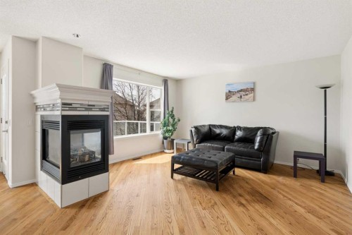 68 Cranfield Place Se, Calgary, AB - Indoor Photo Showing Living Room With Fireplace