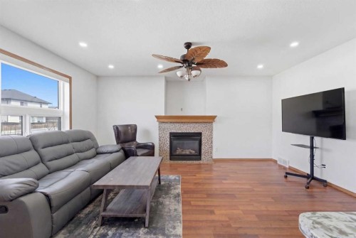 139 Saddlehorn Close Ne, Calgary, AB - Indoor Photo Showing Living Room With Fireplace