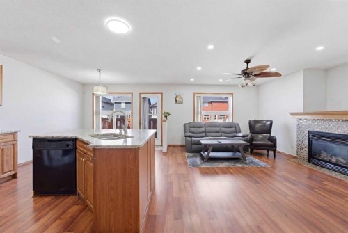 139 Saddlehorn Close Ne, Calgary, AB - Indoor Photo Showing Other Room With Fireplace