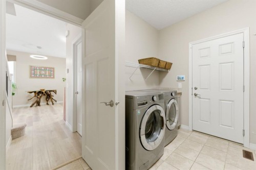 99 Marquis Cove Se, Calgary, AB - Indoor Photo Showing Laundry Room